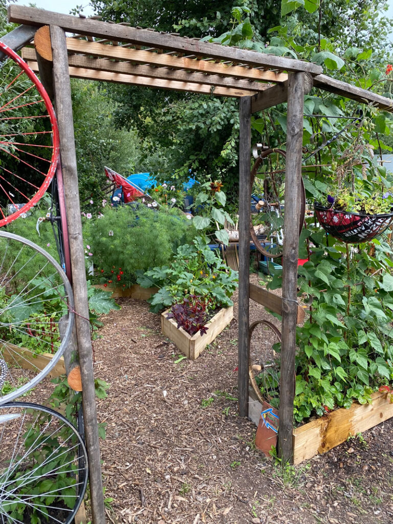 Archway made from re-claimed timber and bike wheels